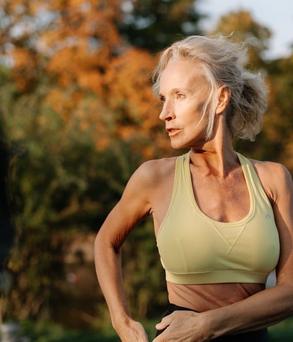 Woman in a calm yoga pose showing flexibility and balance.